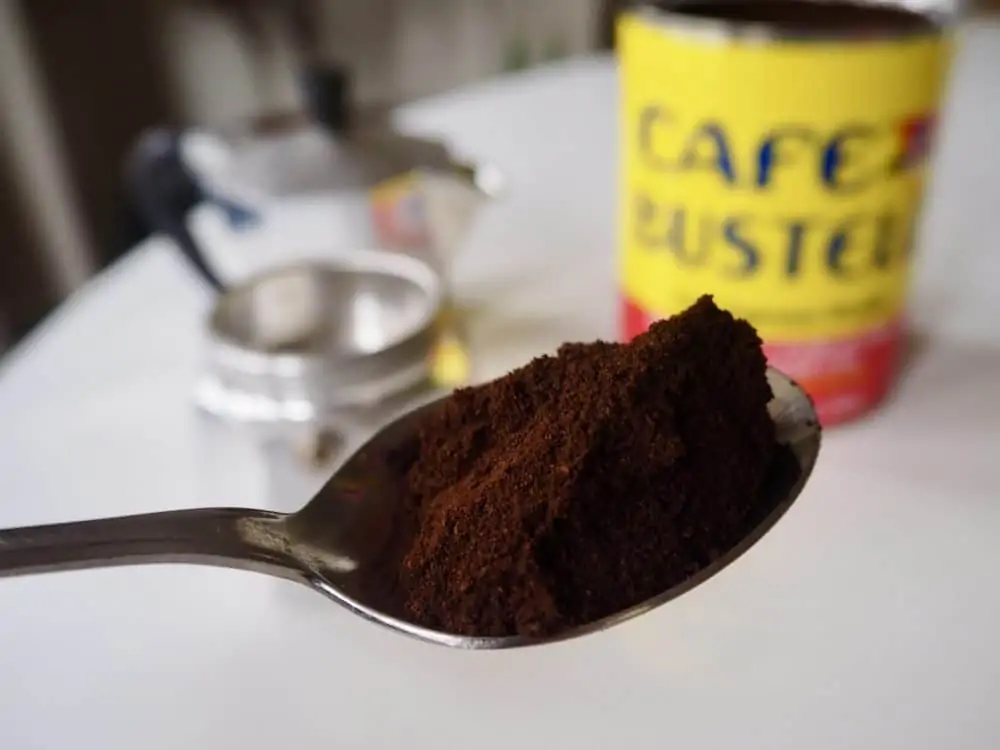 Café Bustelo grounds in a spoon